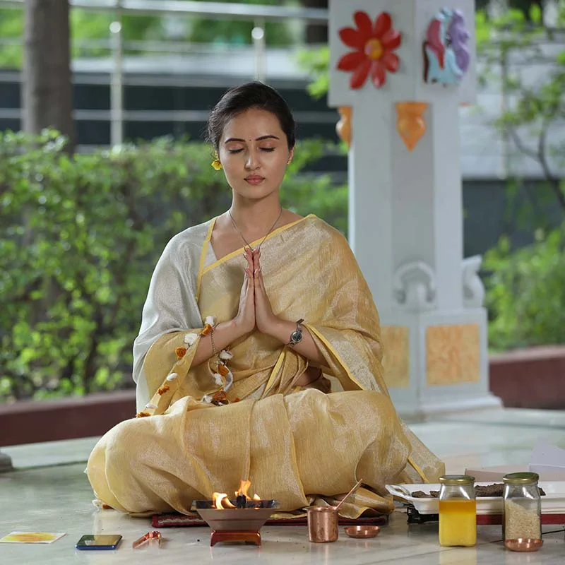 Woman practicing Agnihotra in everyday life